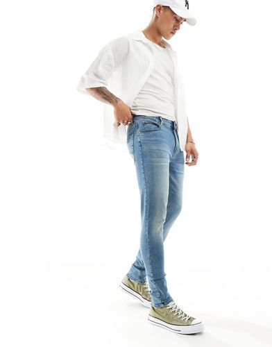 Jeans spray on power stretch lavaggio tinto verde - ASOS DESIGN - Modalova