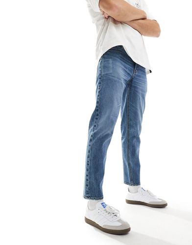 Jeans stretch affusolati lavaggio medio - ASOS DESIGN - Modalova