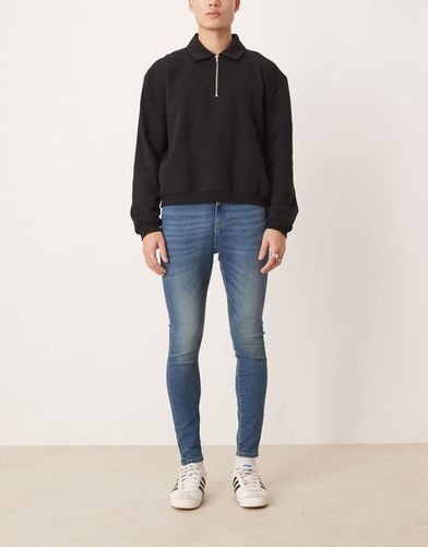 Jeans power stretch lavaggio scuro - ASOS DESIGN - Modalova