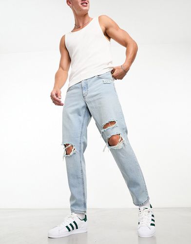 Jeans rigidi modello classico lavaggio chiaro con strappi sulle ginocchia - ASOS DESIGN - Modalova