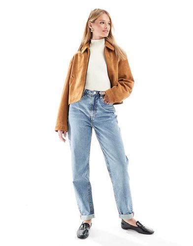 Mom jeans a vita alta vestibilità comoda lavaggio vintage - ASOS DESIGN - Modalova