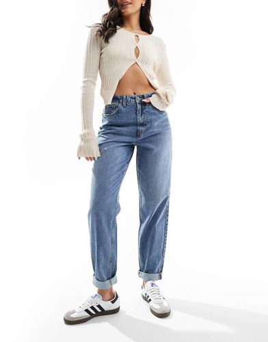 Mom jeans comodi a vita alta medio - ASOS DESIGN - Modalova