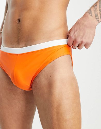 Slip da bagno arancioni con elastico in vita a contrasto - ASOS DESIGN - Modalova