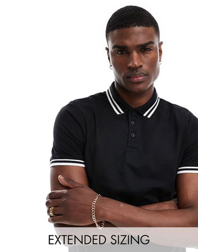 Polo in piqué nera con bordi a contrasto - ASOS DESIGN - Modalova