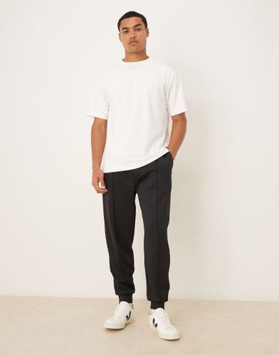 Pantalon de jogging fuselé en tissu imitation néoprène épais - Asos Design - Modalova