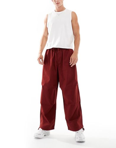 Pantaloni oversize da paracadutista a palloncino bordeaux - ASOS DESIGN - Modalova