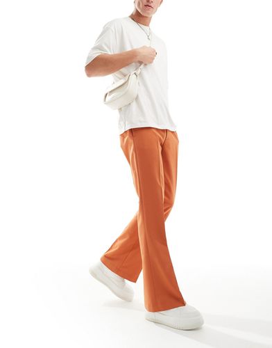 Pantaloni a zampa eleganti arancioni - ASOS DESIGN - Modalova