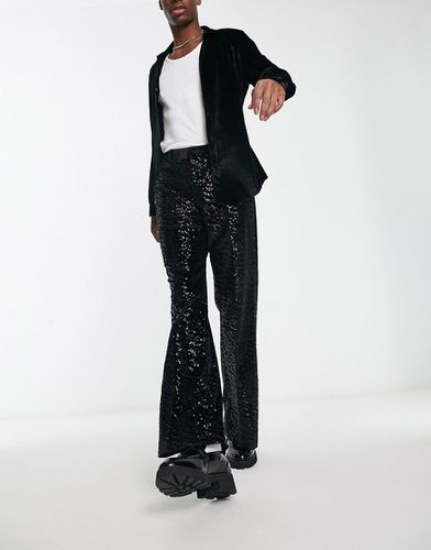 Pantaloni a zampa eleganti in paillettes neri - ASOS DESIGN - Modalova
