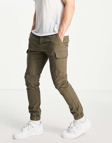 Pantaloni cargo skinny con fondo elasticizzato kaki - ASOS DESIGN - Modalova