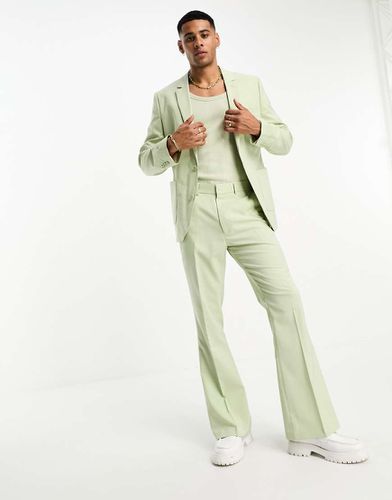 Pantaloni da abito a zampa pallido - ASOS DESIGN - Modalova