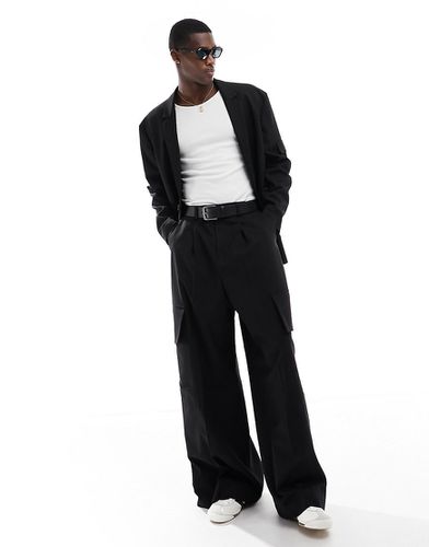 Pantaloni da abito cargo super ampi neri - ASOS DESIGN - Modalova
