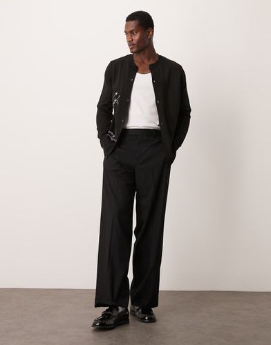 Pantaloni da smoking ampi neri - ASOS DESIGN - Modalova