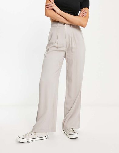 Pantaloni dad a fondo ampio color pietra - ASOS DESIGN - Modalova