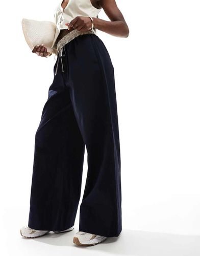 Pantaloni in flanella con fascia in vita a contrasto - ASOS DESIGN - Modalova