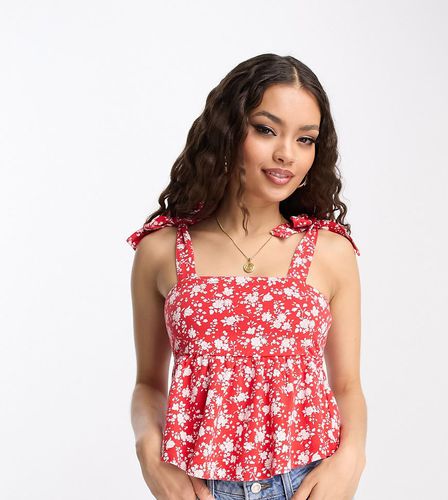 ASOS DESIGN Petite - Top prendisole con spalline annodate e peplo rosso a fiori - ASOS Petite - Modalova