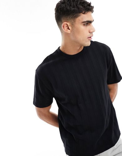 T-shirt comoda nera testurizzata a coste - ASOS DESIGN - Modalova