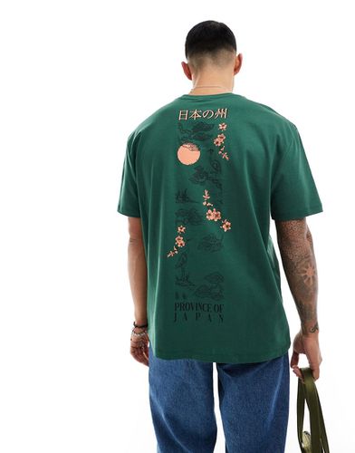 T-shirt comoda scuro con stampa souvenir sul retro - ASOS DESIGN - Modalova