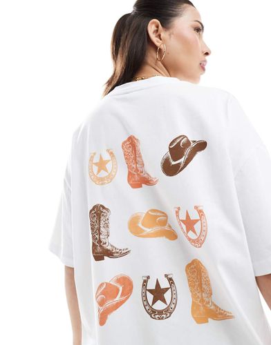 T-shirt oversize bianca con grafica di cowboy - ASOS DESIGN - Modalova