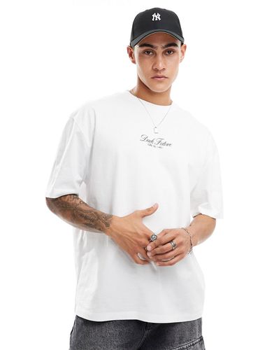 T-shirt oversize bianca con scritta sul petto - ASOS DESIGN - Modalova
