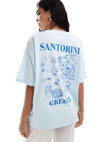 T-shirt oversize celeste con grafica Santorini - ASOS DESIGN - Modalova