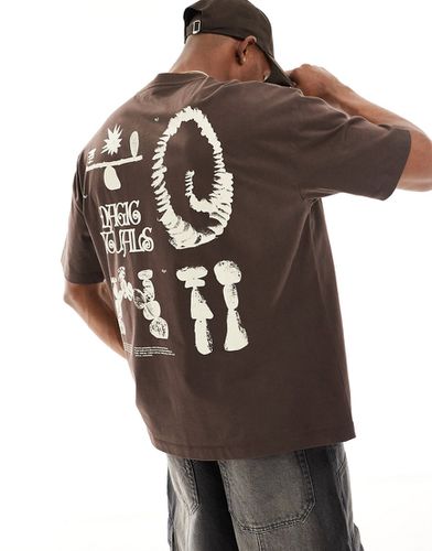 T-shirt oversize scuro con stampe multiple - ASOS DESIGN - Modalova