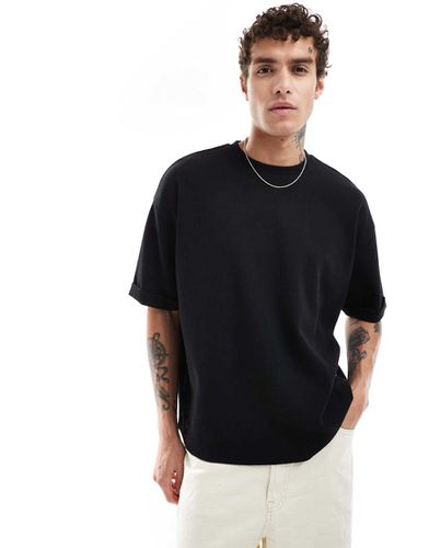 T-shirt oversize nera con maniche arrotolate e lavorazione a nido d'ape - ASOS DESIGN - Modalova