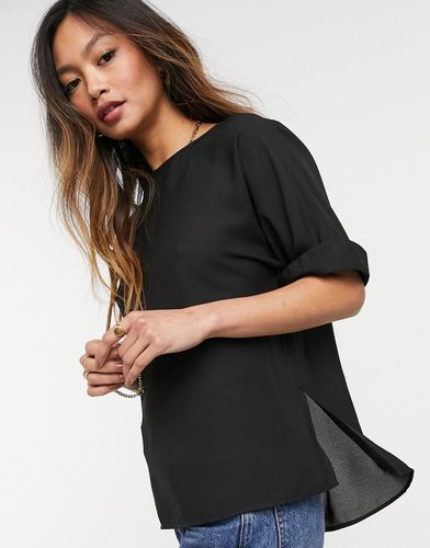 T-shirt oversize nera con maniche con risvolto - ASOS DESIGN - Modalova