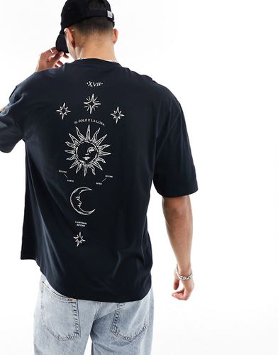 T-shirt oversize nera con stampa di luna sul retro - ASOS DESIGN - Modalova