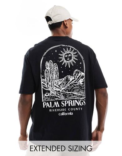 T-shirt oversize nera con stampa "Palm Springs" sul retro - ASOS DESIGN - Modalova