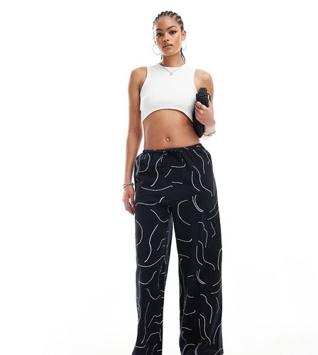 ASOS DESIGN Tall - Pantaloni a fondo ampio in misto lino neri con stampa bianca - ASOS Tall - Modalova