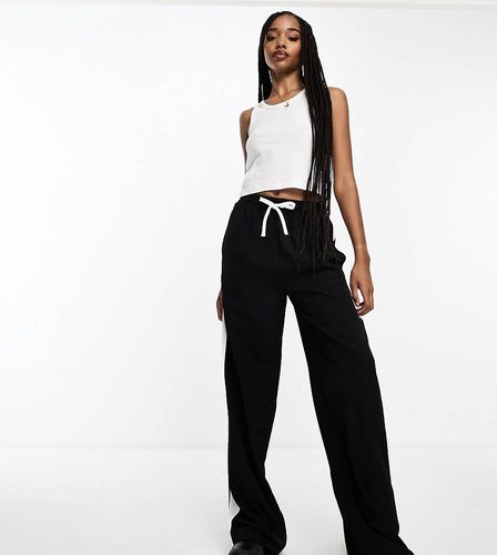 Tall - Pantaloni neri con pannello a contrasto - ASOS DESIGN - Modalova