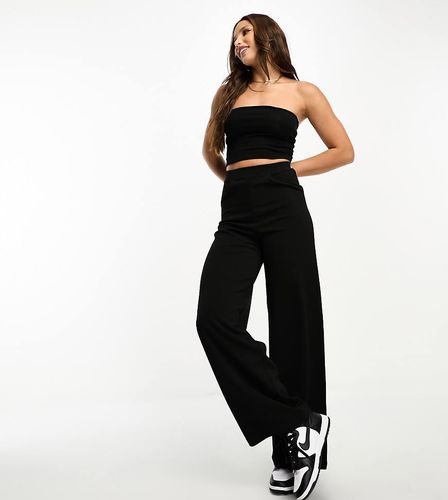 ASOS DESIGN Tall - Pantaloni sartoriali in jersey a fondo ampio neri - ASOS Tall - Modalova