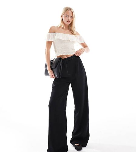 ASOS DESIGN Tall - Pantaloni sartoriali neri a pieghe con cuciture a contrasto - ASOS Tall - Modalova