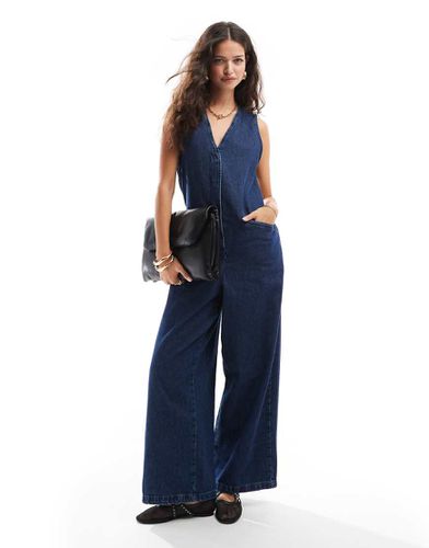 Tuta jumpsuit ampia senza maniche in denim lavaggio rinse wash - ASOS DESIGN - Modalova