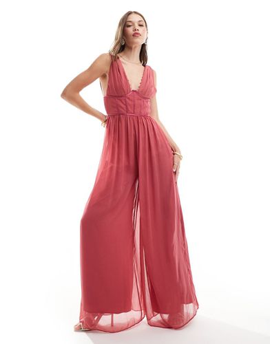 Tuta jumpsuit con fondo ampio e scollo profondo rosa scuro con dettaglio in raso a contrasto e bottoni - ASOS DESIGN - Modalova