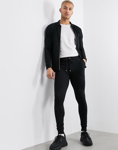 Tuta sportiva attillata con giubbino - ASOS DESIGN - Modalova