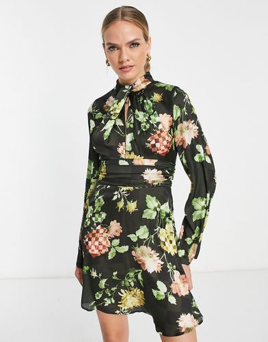 Vestito corto accollato con stampa a fiori pixellata e incrocio sul davanti - ASOS DESIGN - Modalova