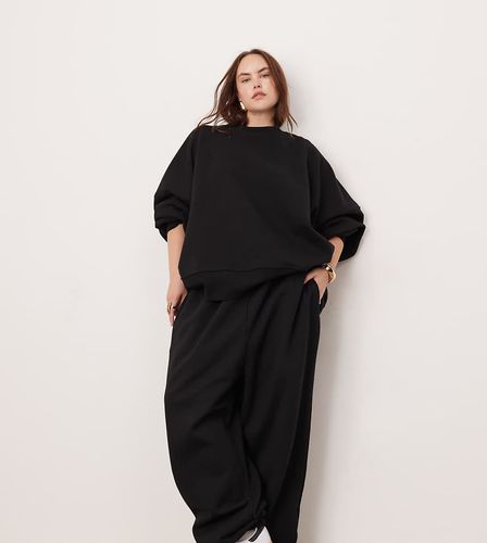 Curve - Joggers premium oversize pesante nera - ASOS EDITION - Modalova