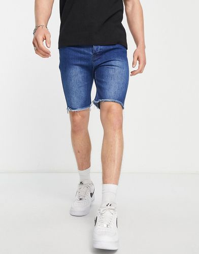 Pantaloncini di jeans slim con fondo grezzo indaco medio - Bolongaro Trevor - Modalova