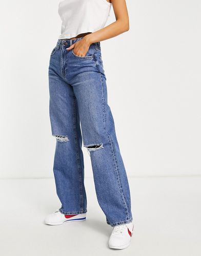 Jeans ani '90 con fondo ampio medio con strappi - Bershka - Modalova