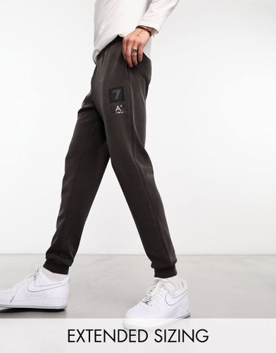 Soft Touch - Joggers marrone scuro con logo morbido al tatto - EA7 - Modalova