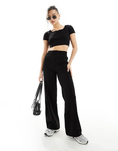 Pantaloni con fondo ampio in maglia traforata neri in coordinato - Fashionkilla - Modalova