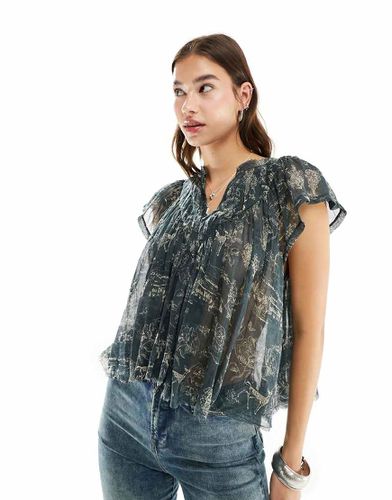 Blusa a punto smock intenso in voile con stampa a fiori - Free People - Modalova