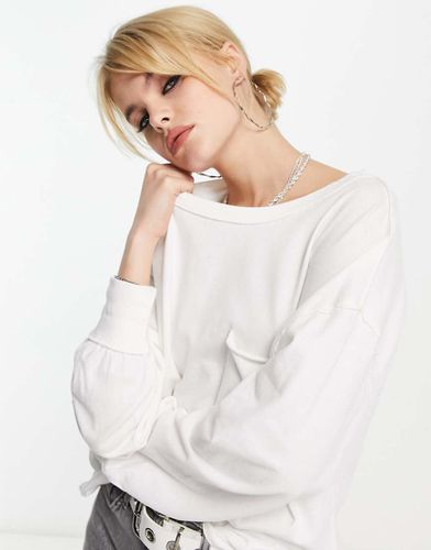 Top a maniche lunghe casual color avorio - Free People - Modalova