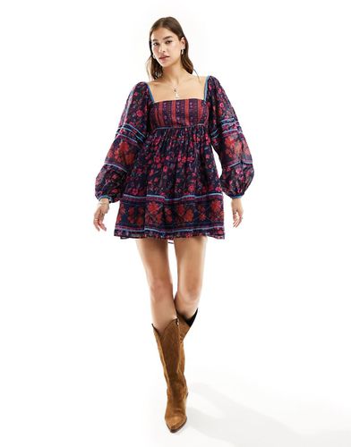 Vestito grembiule corto stile babydoll con stampa a fiori - Free People - Modalova