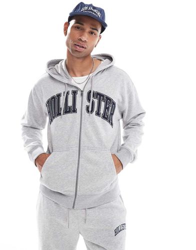 Felpa con cappuccio comoda mélange con logo college e zip - Hollister - Modalova