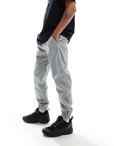 Joggers skinny in nylon e cotone chiaro con polsini - Hollister - Modalova