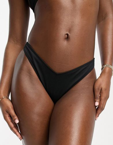 Slip bikini sgambato nero a coste con design a V in coordinato - Hollister - Modalova