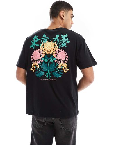 T-shirt oversize nera con stampa di fiori - Jack & Jones - Modalova