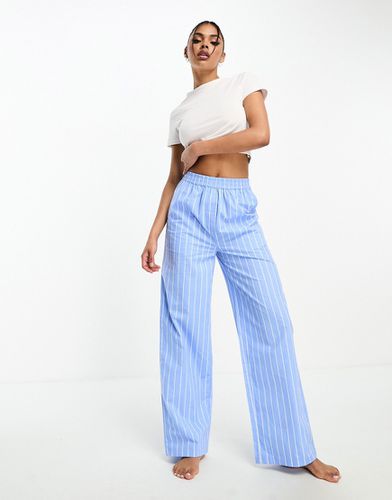 Pantaloni del pigiama oversize in cotone a fondo ampio con righe - Luna - Modalova